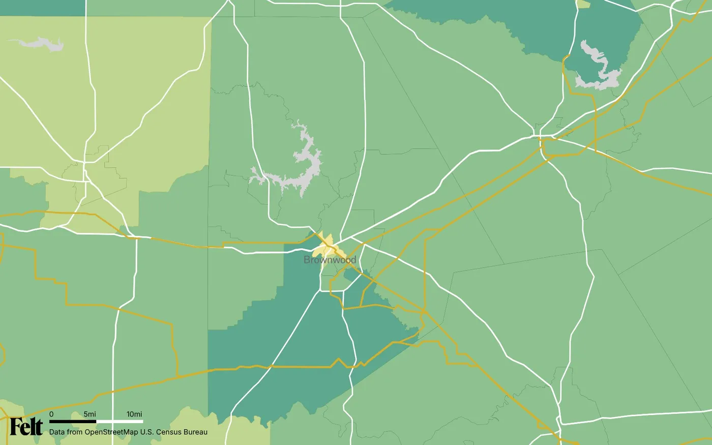 Map of Brown County, Texas: the county outlined, with transmission lines over median household income by census tract