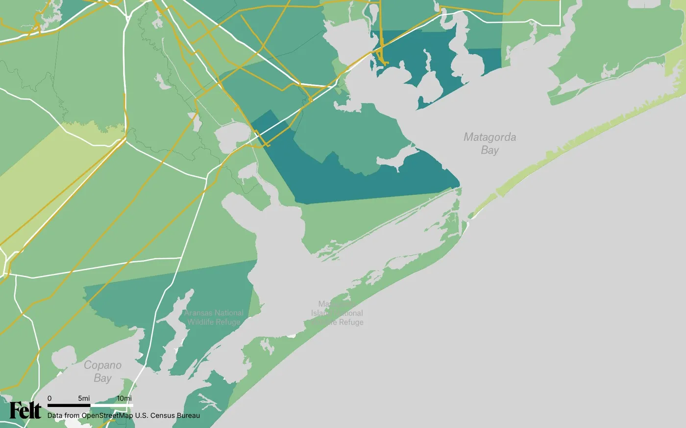 Map of Calhoun County, Texas: the county outlined, with transmission lines over median household income by census tract