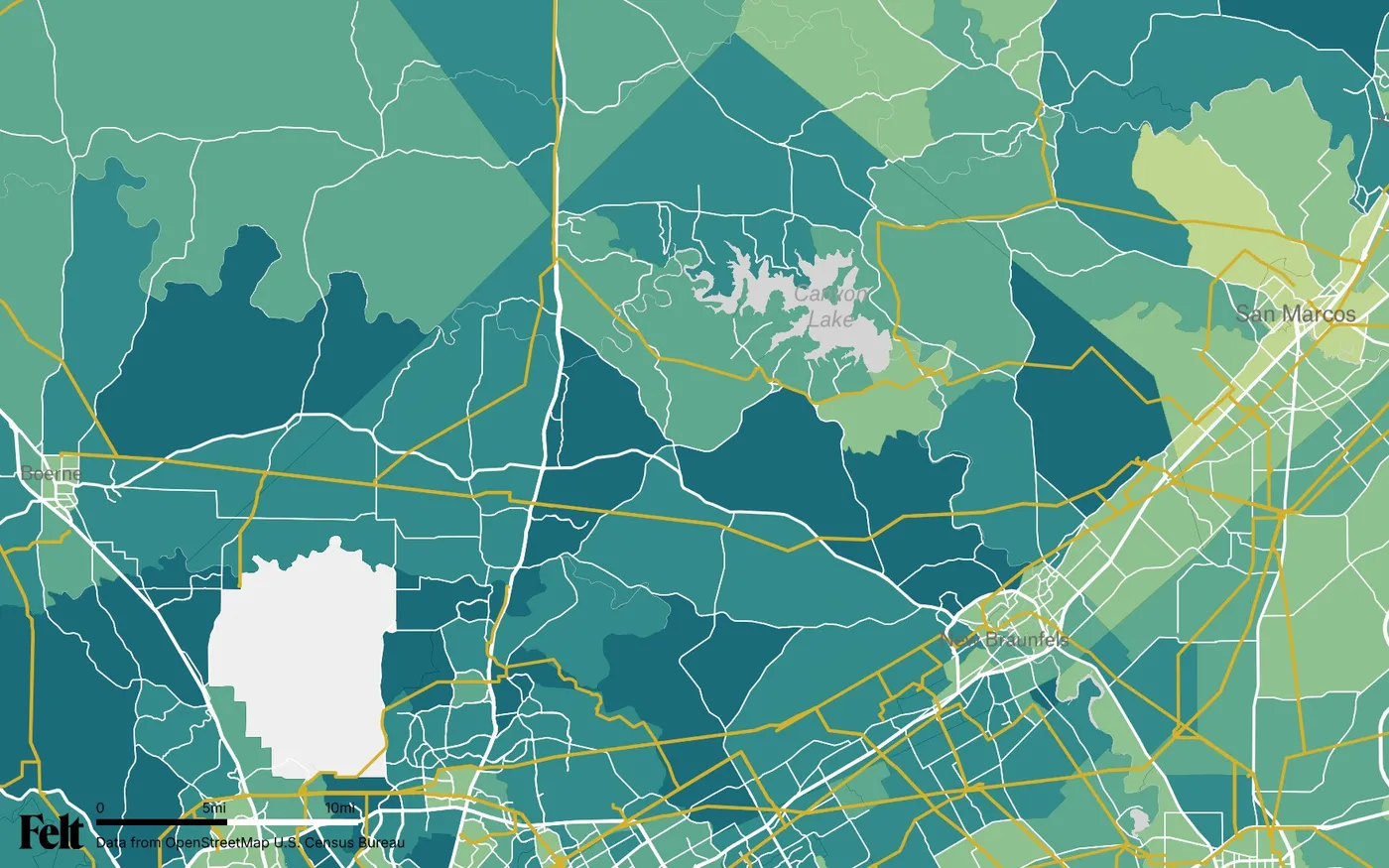 Map of Comal County, Texas: the county outlined, with transmission lines over median household income by census tract