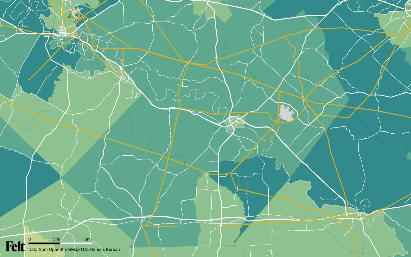 Map of Fayette County, Texas: the county outlined, with transmission lines over median household income by census tract