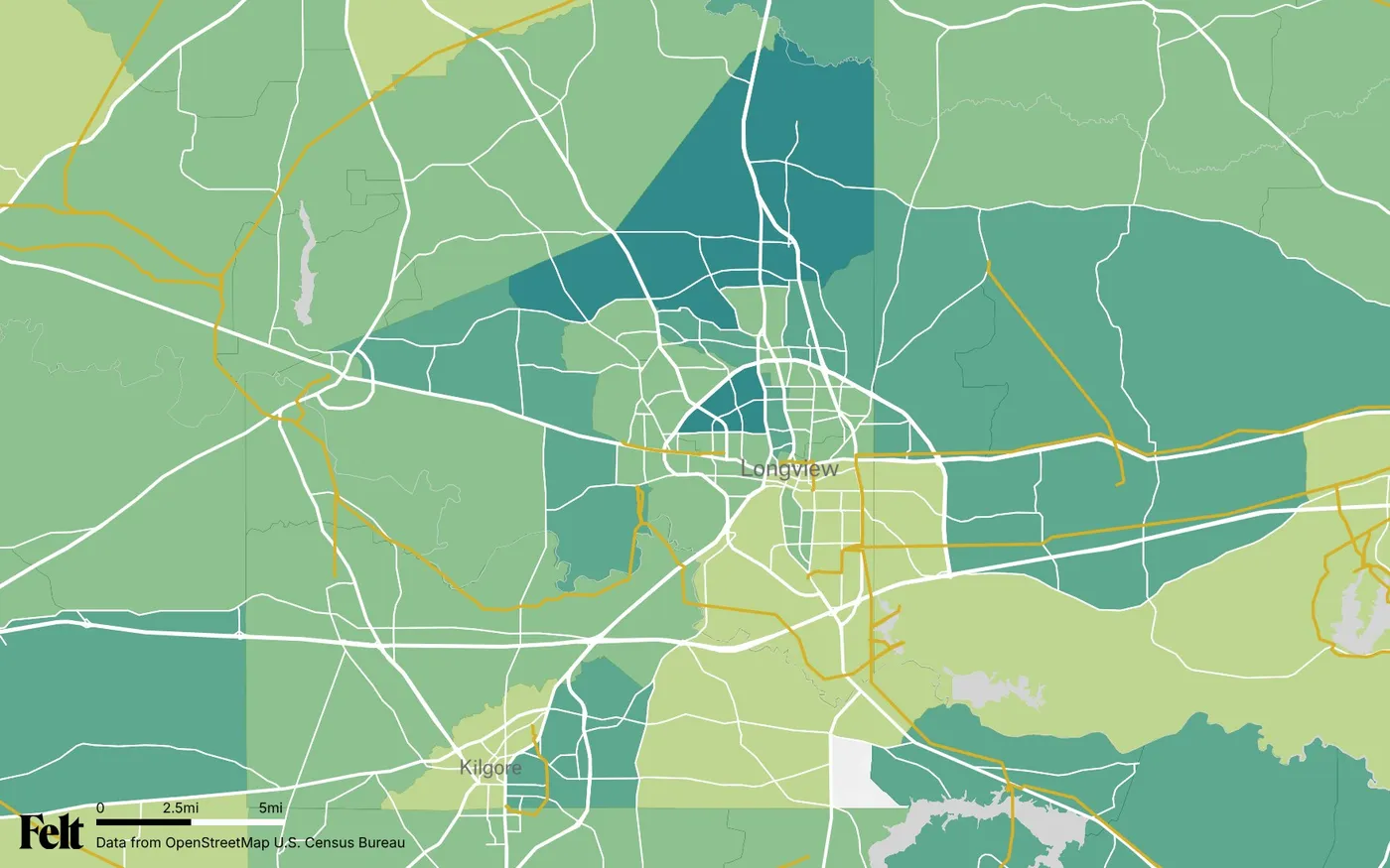 Map of Gregg County, Texas: the county outlined, with transmission lines over median household income by census tract