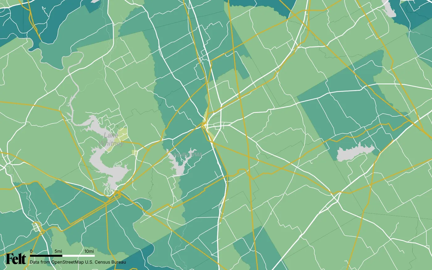 Map of Hill County, Texas: the county outlined, with transmission lines over median household income by census tract