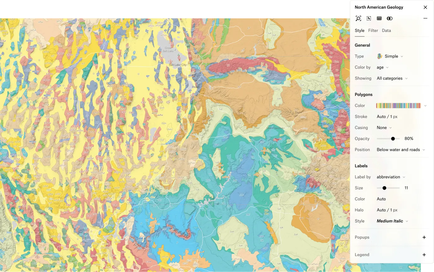 A North American geology map in Felt, polygons colored by rock age, with the style panel open to its polygon and label settings