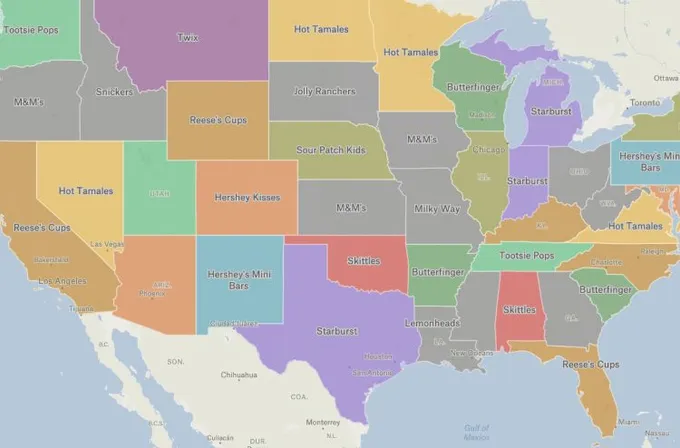 A Felt map of US states colored and labeled by most popular Halloween candy, such as Twix, Starburst and Skittles