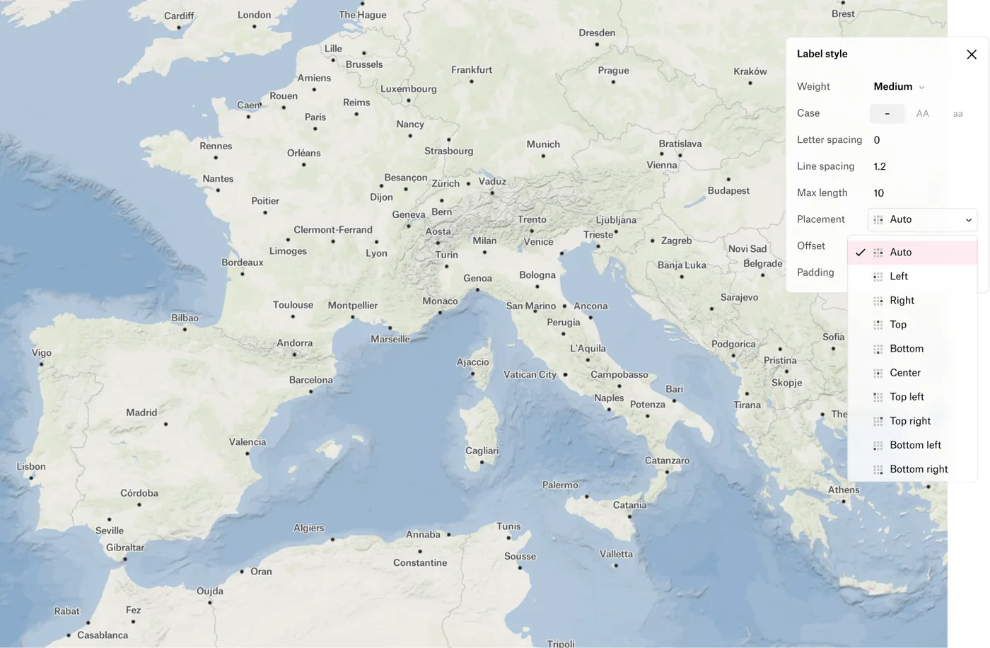 A map of southern Europe with city labels, and the label style panel open to its placement options, from Auto to Bottom right