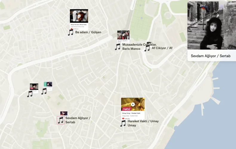 A Felt map of Istanbul with music notes and video thumbnails marking where 90s music videos were filmed