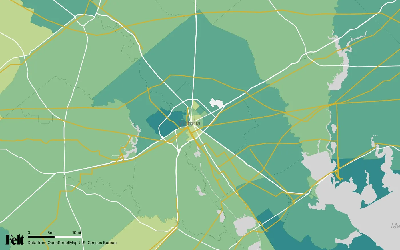 Map of Victoria County, Texas: the county outlined, with transmission lines over median household income by census tract